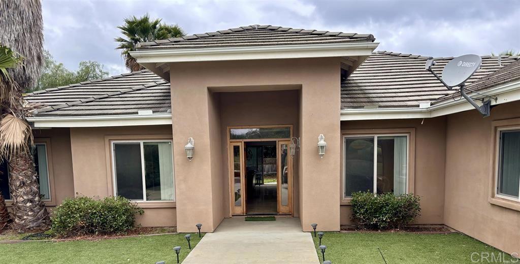 2399 Paige Circle Fallbrook, CA 92028 - Photo 2 of 18 a front view of a house with garden