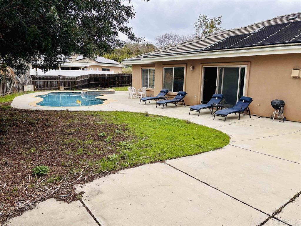 2399 Paige Circle Fallbrook, CA 92028 - Photo 3 of 18 a view of a swimming pool with chairs and plants