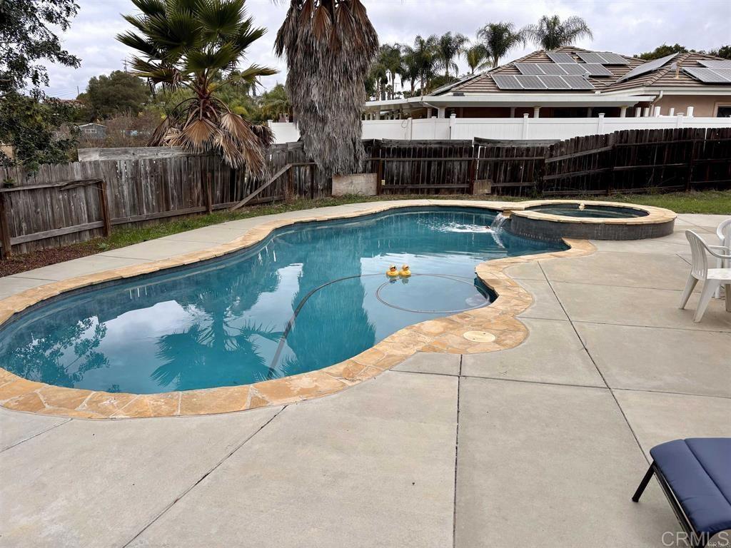 2399 Paige Circle Fallbrook, CA 92028 - Photo 4 of 18 a view of a swimming pool with a patio and plants