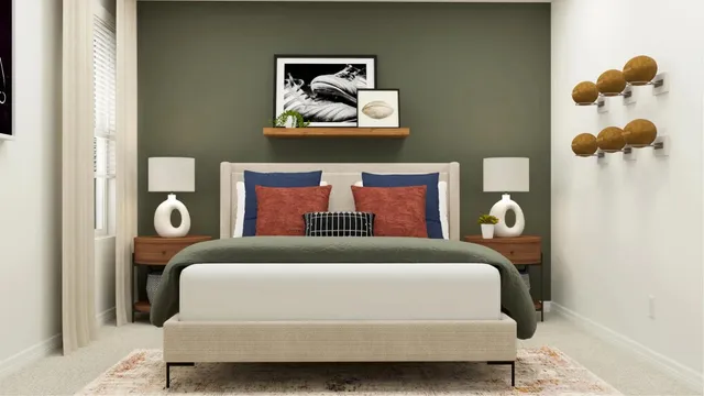 a bedroom with a bed and a painting on the wall