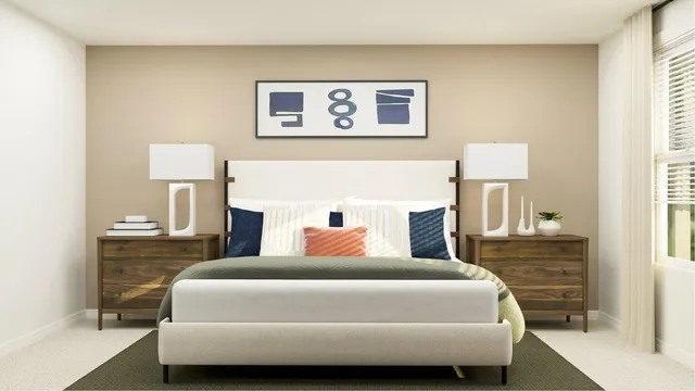 a bedroom with a bed and a lamp on table