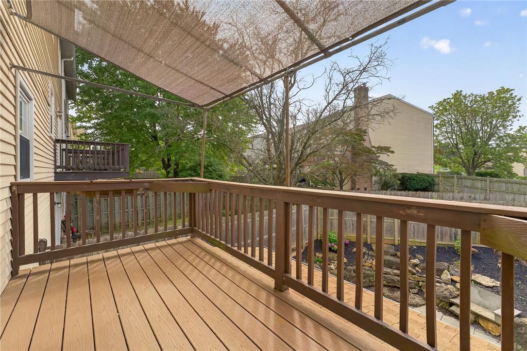 1097 Barnside Road Allentown, PA 18103 - Photo 18 of 22 An elevated wood deck with built-in railing overlooks the landscaped yard
