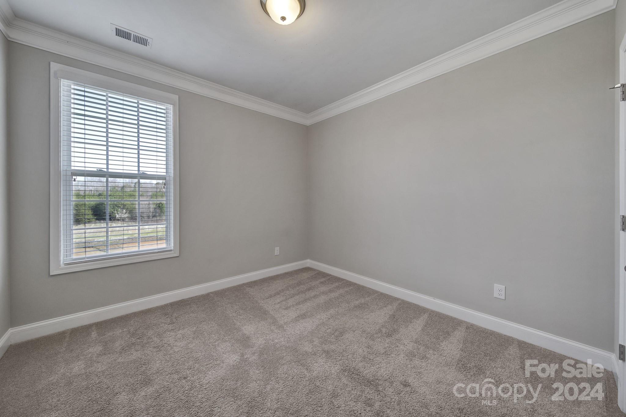 9518 Inverness Bay Road Charlotte, NC 28278 - Photo 16 of 42 an empty room with a window