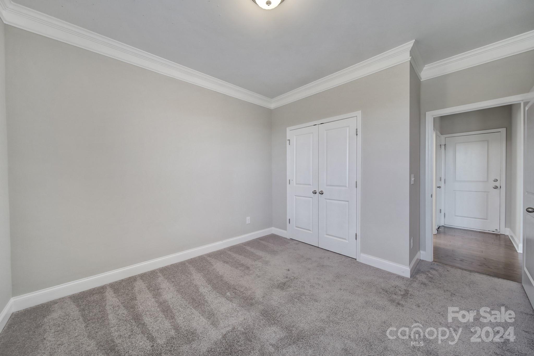 9518 Inverness Bay Road Charlotte, NC 28278 - Photo 17 of 42 a view of an empty room and chandelier fan