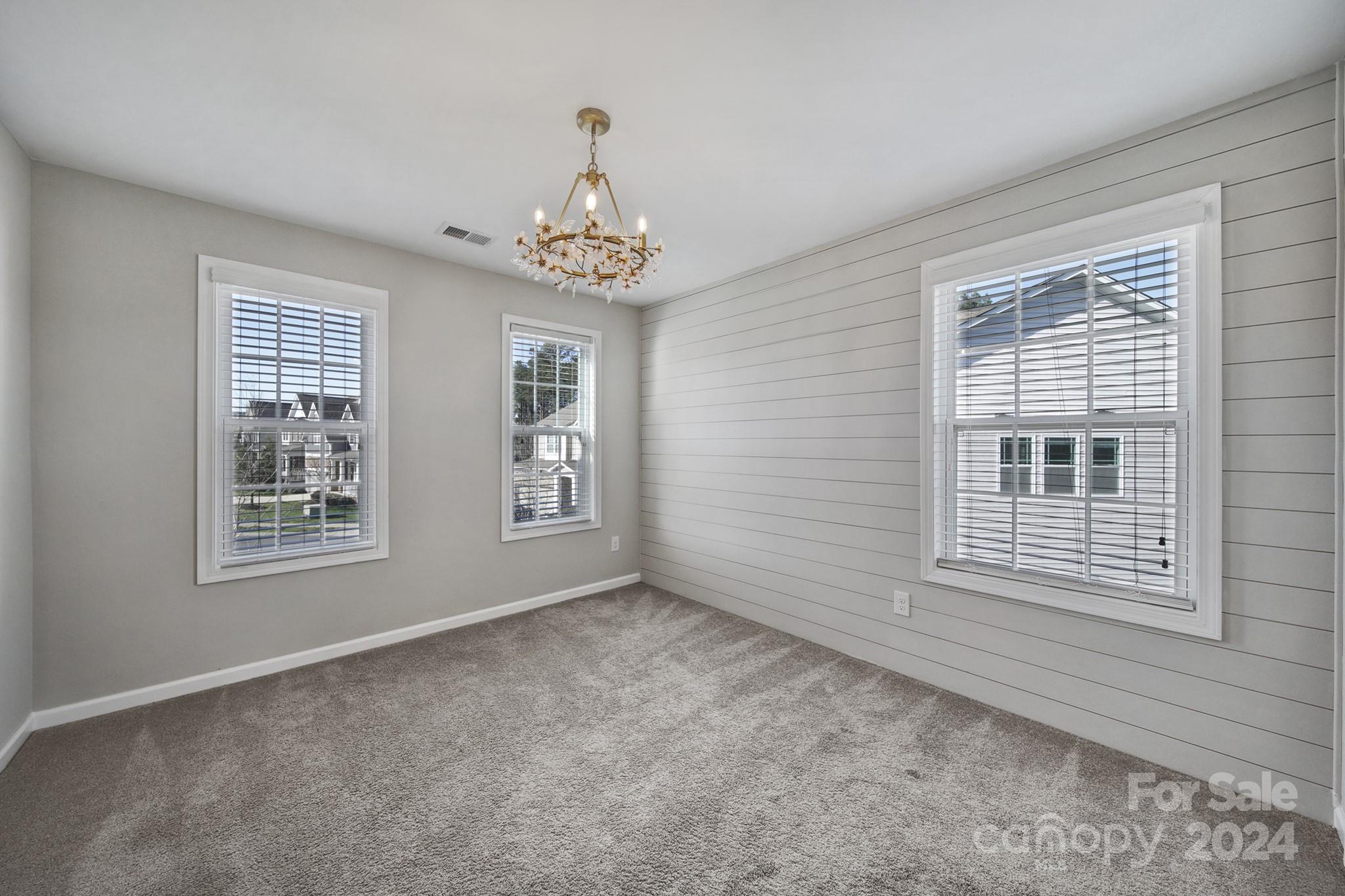 9518 Inverness Bay Road Charlotte, NC 28278 - Photo 21 of 42 a view of an empty room with a window