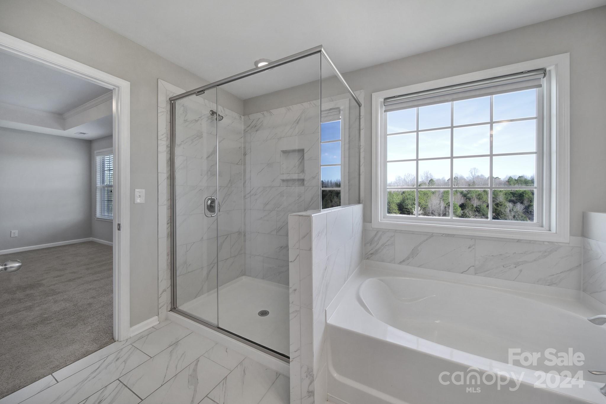 9518 Inverness Bay Road Charlotte, NC 28278 - Photo 28 of 42 a bathroom with a shower and a bathtub