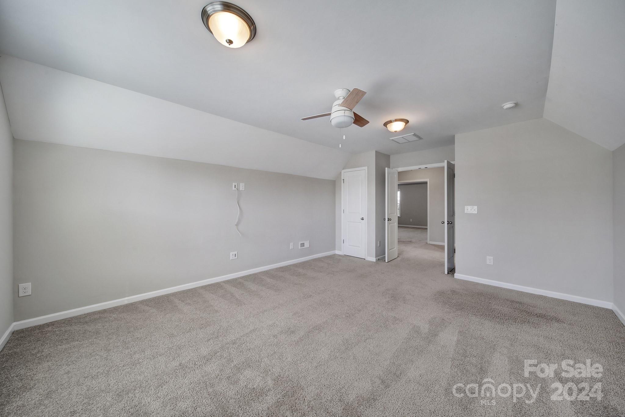 9518 Inverness Bay Road Charlotte, NC 28278 - Photo 32 of 42 a view of a livingroom with a ceiling fan and window
