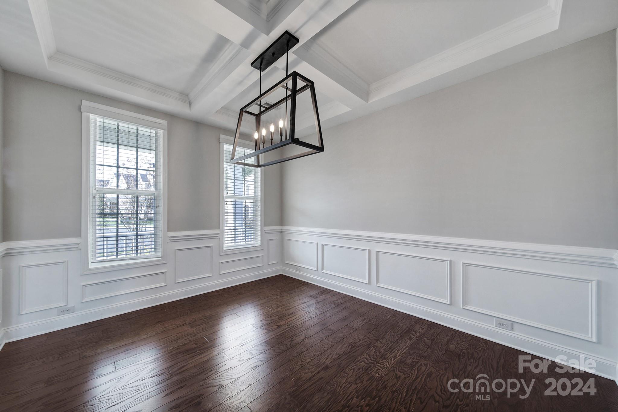9518 Inverness Bay Road Charlotte, NC 28278 - Photo 4 of 42 an empty room with wooden floor and windows