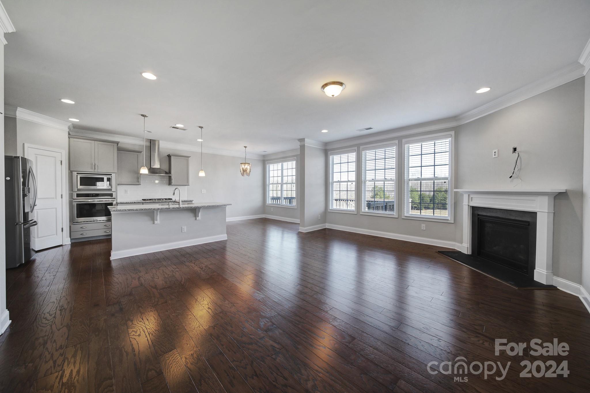 9518 Inverness Bay Road Charlotte, NC 28278 - Photo 8 of 42 a view of kitchen with stove and wooden floor