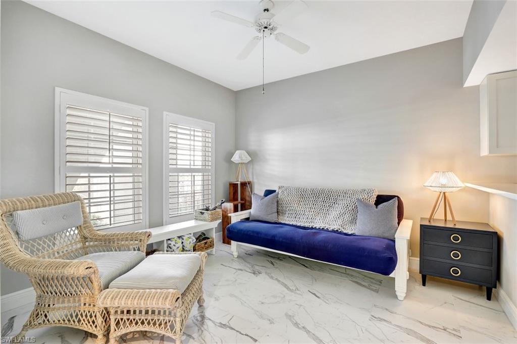5897 Chanteclair Drive, Unit 314 Naples, FL 34108 - Photo 12 of 20 a living room with furniture and a window