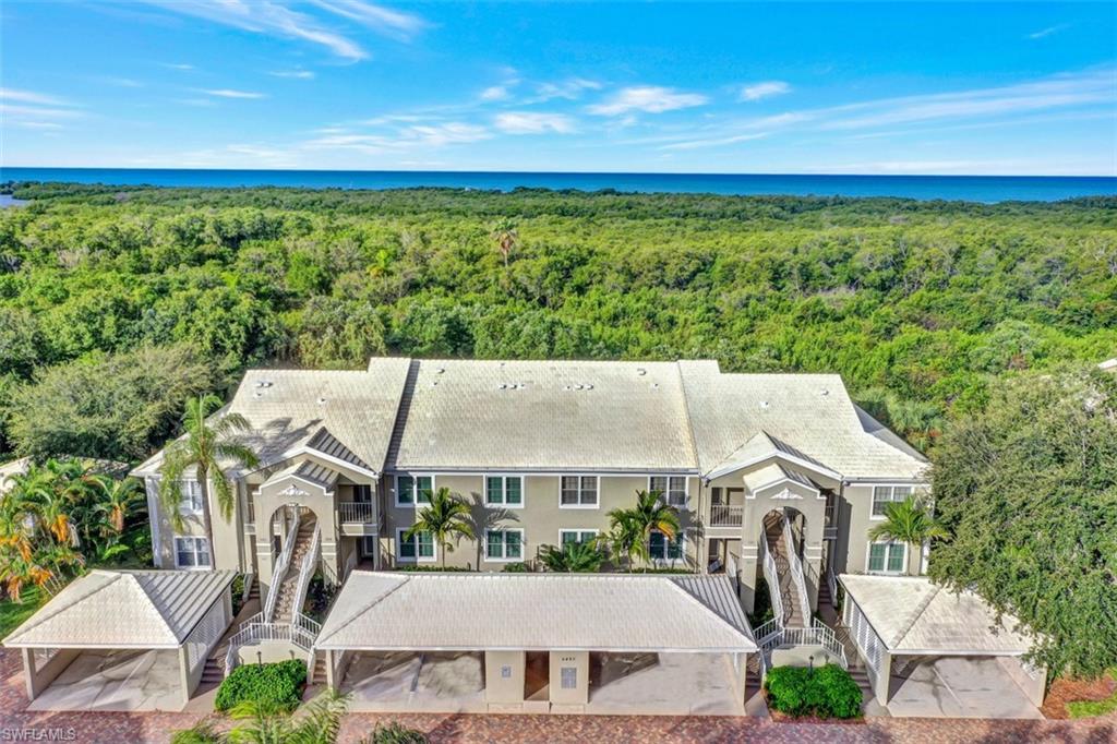 5897 Chanteclair Drive, Unit 314 Naples, FL 34108 - Photo 20 of 20 an aerial view of a house with a garden