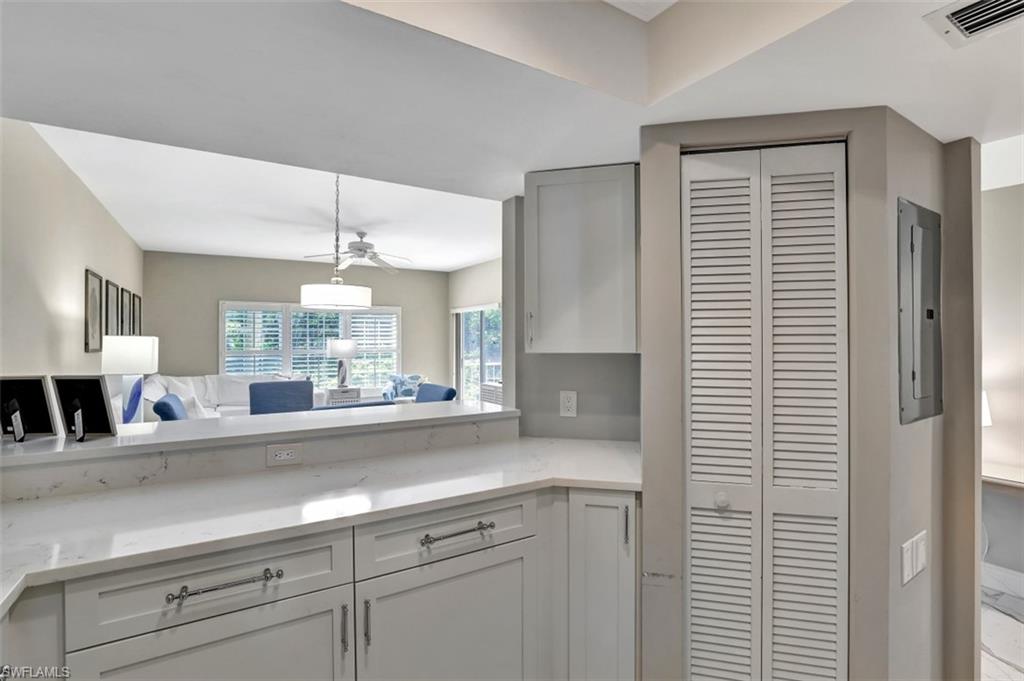 5897 Chanteclair Drive, Unit 314 Naples, FL 34108 - Photo 4 of 20 a view of a counter top a sink and cabinets
