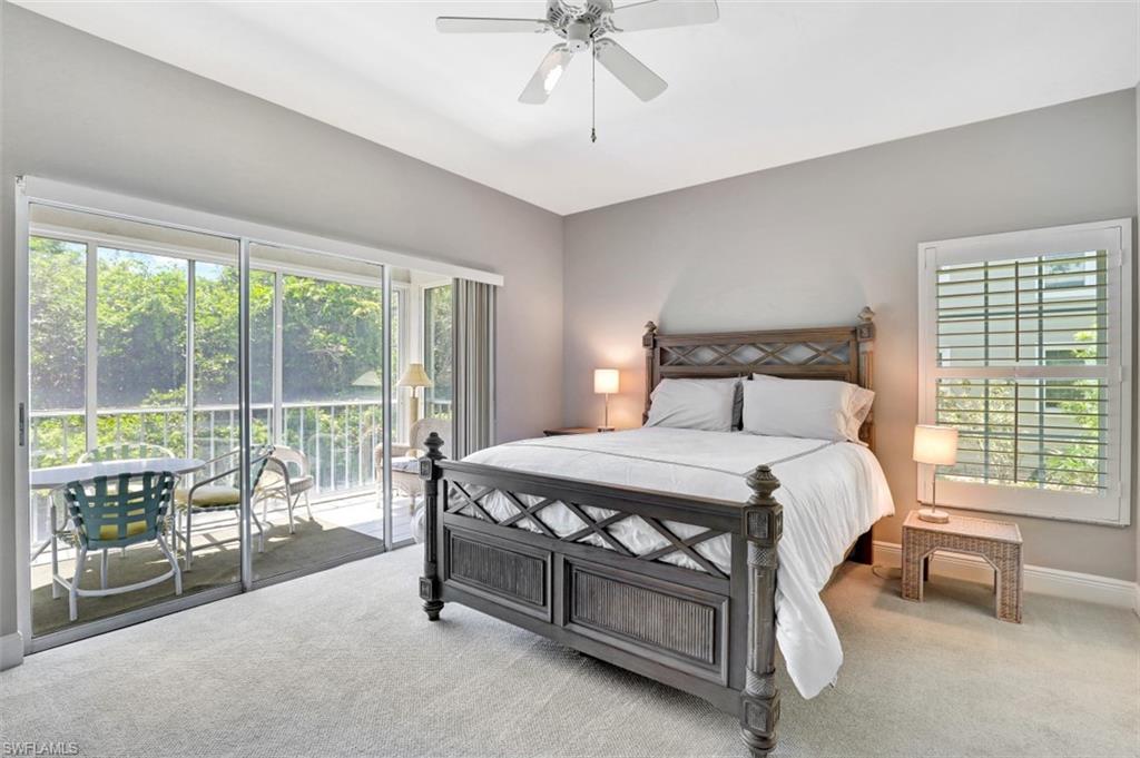 5897 Chanteclair Drive, Unit 314 Naples, FL 34108 - Photo 8 of 20 a bedroom with a bed and a balcony
