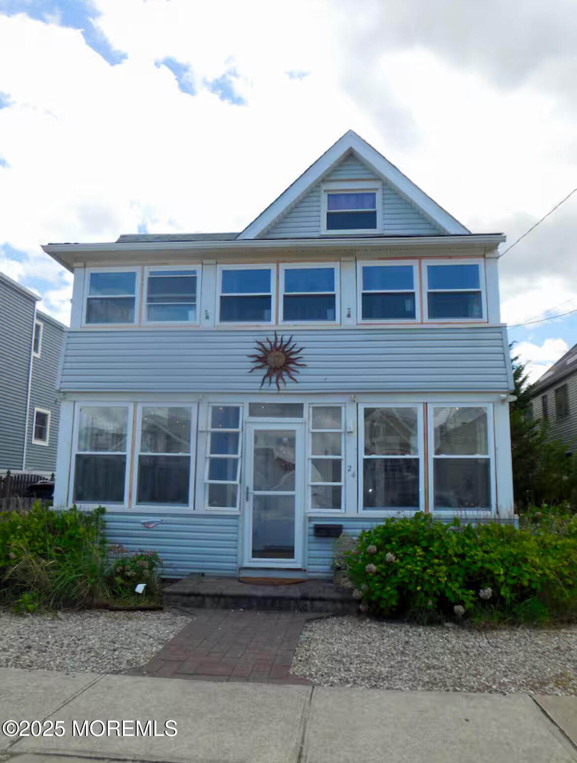 24 Philadelphia Avenue Lavallette, NJ 08735 - Photo 1 of 41 a front view of a house with a yard