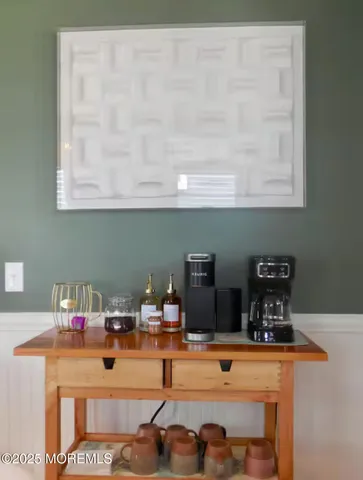 a kitchen with a refrigerator and a stove top oven