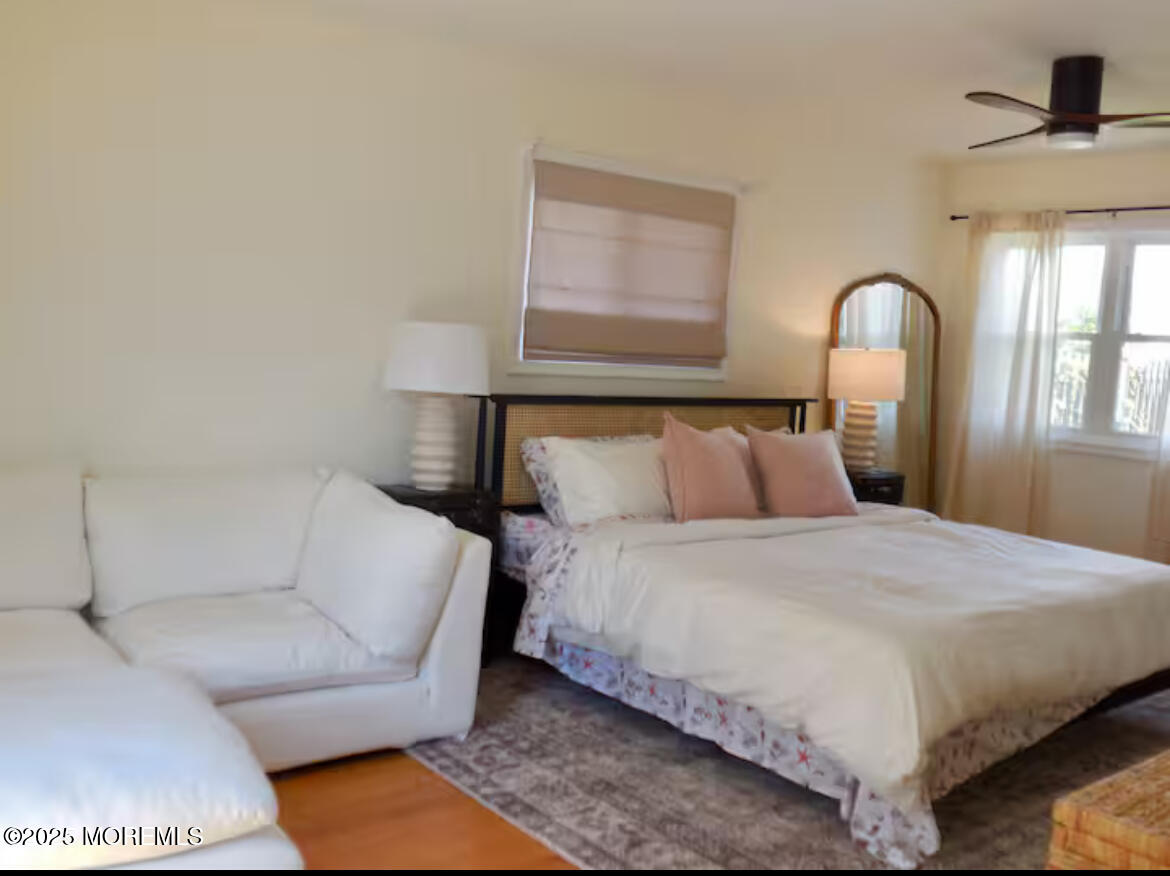 24 Philadelphia Avenue Lavallette, NJ 08735 - Photo 19 of 41 a bedroom with a bed and a large mirror