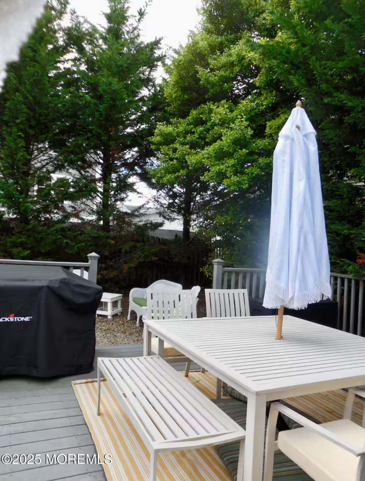 24 Philadelphia Avenue Lavallette, NJ 08735 - Photo 34 of 41 a view of a patio with table and chairs