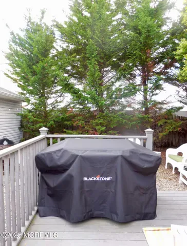 a view of barbeque grill with granite counter top