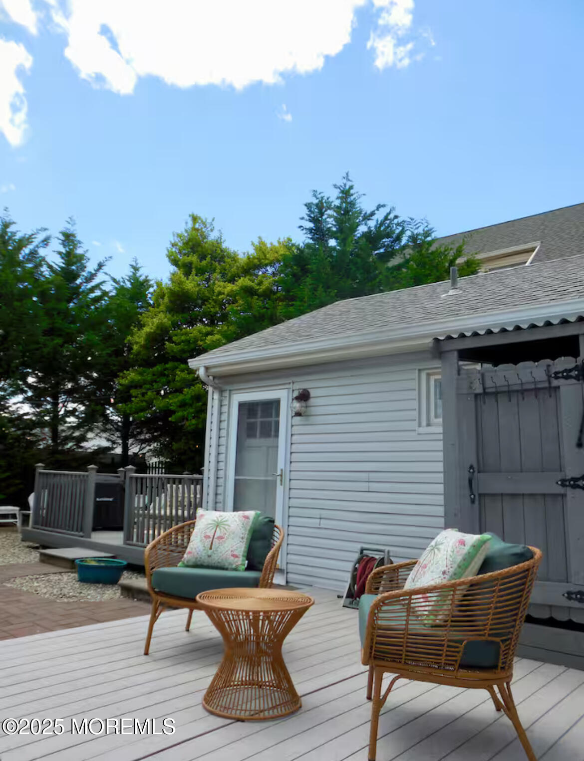 24 Philadelphia Avenue Lavallette, NJ 08735 - Photo 39 of 41 a backyard of a house with table and chairs