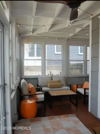 a living room with furniture and windows