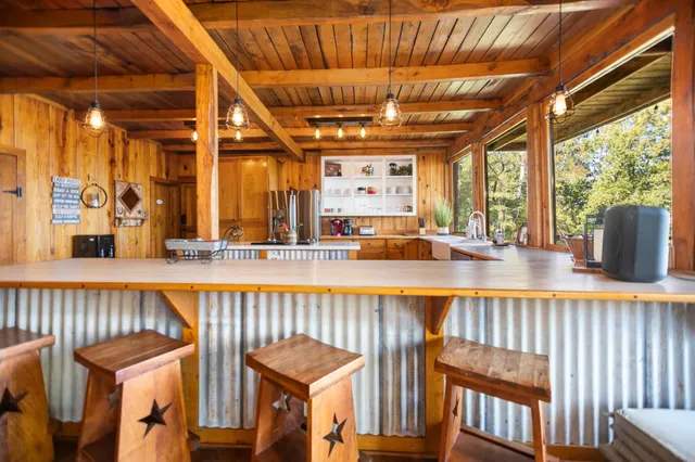 a kitchen with cabinets and stainless steel appliances