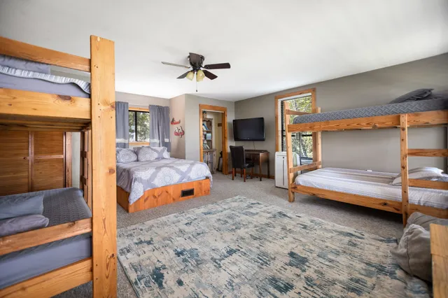 a bathroom with a sink toilet and a mirror