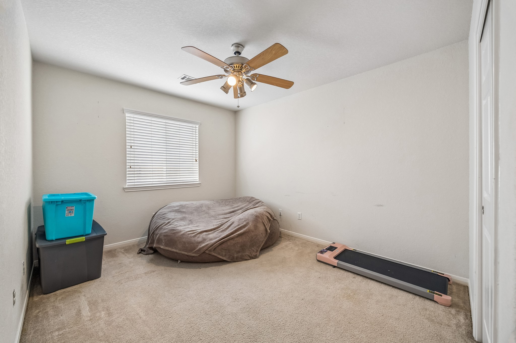 24027 Floragate Drive Spring, TX 77373 - Photo 17 of 21 a room with a bed and a window
