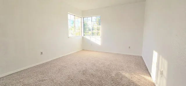 an empty room with windows