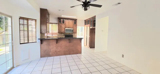 a view of empty room with a fireplace