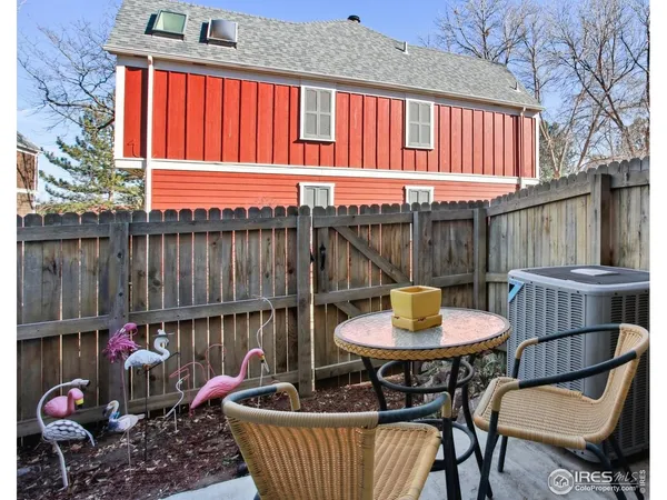 a view of a chairs and table in the patio