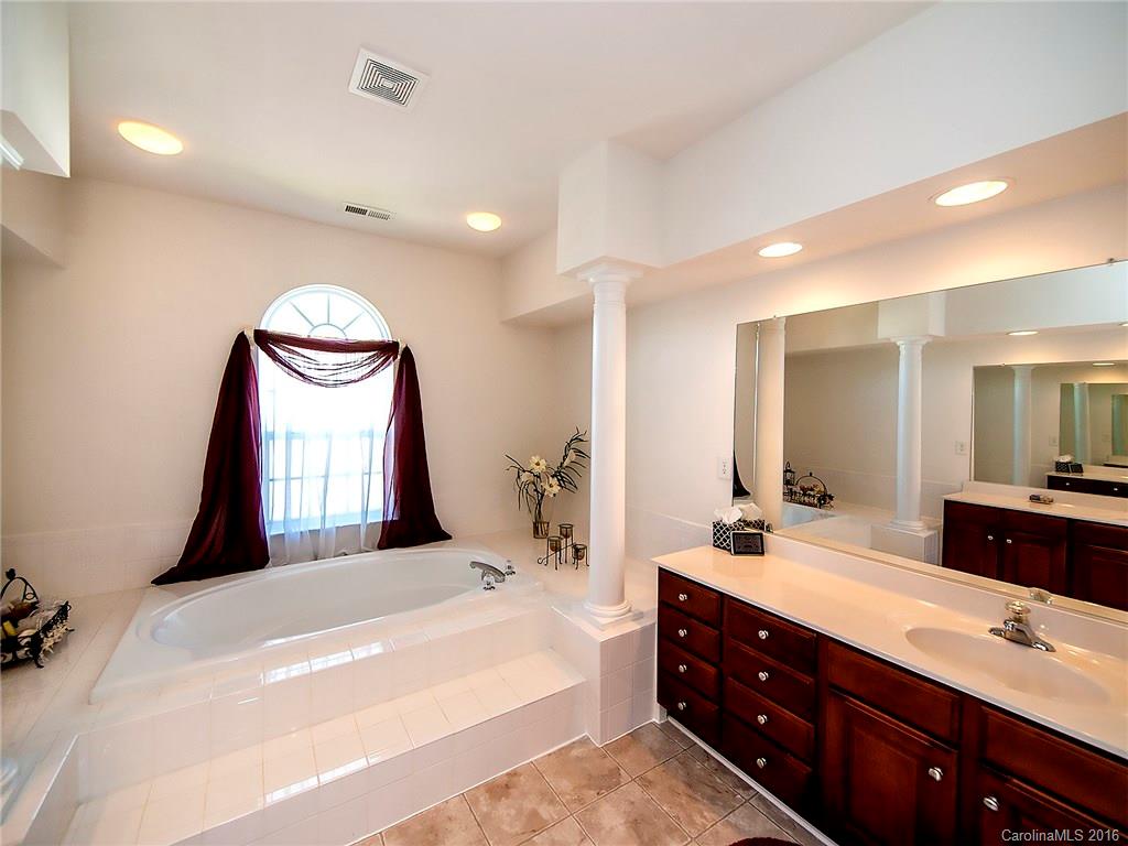 748 Drew Avenue Fort Mill, SC 29708 - Photo 16 of 23 a spacious bathroom with a large tub sink and mirror