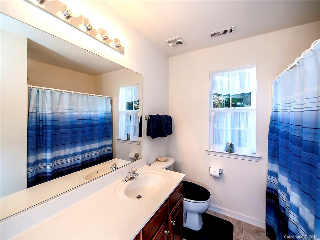 748 Drew Avenue Fort Mill, SC 29708 - Photo 20 of 23 a bathroom with a sink toilet and shower