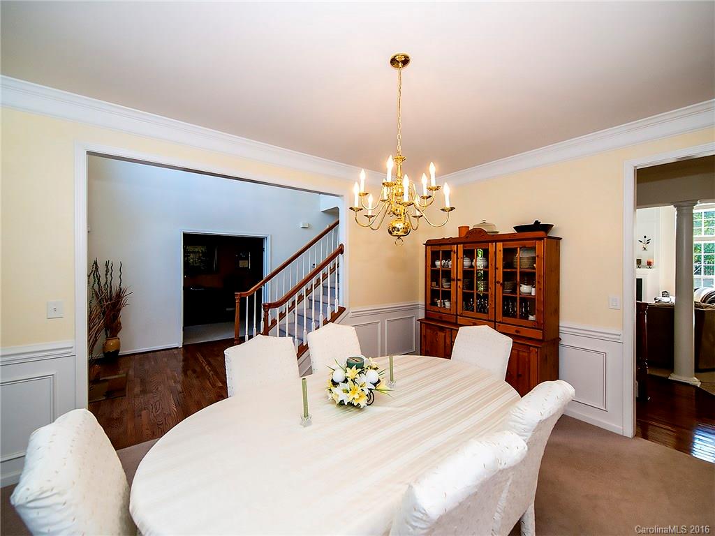 748 Drew Avenue Fort Mill, SC 29708 - Photo 4 of 23 a view of a dining room with furniture a chandelier and wooden floor