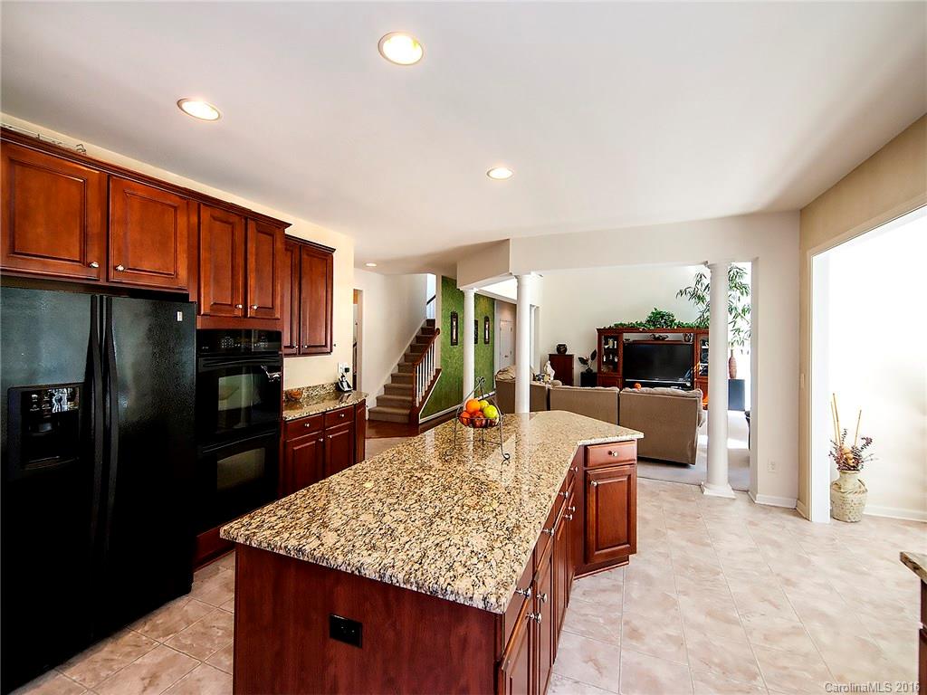 748 Drew Avenue Fort Mill, SC 29708 - Photo 8 of 23 a living room with stainless steel appliances kitchen island granite countertop furniture and a refrigerator