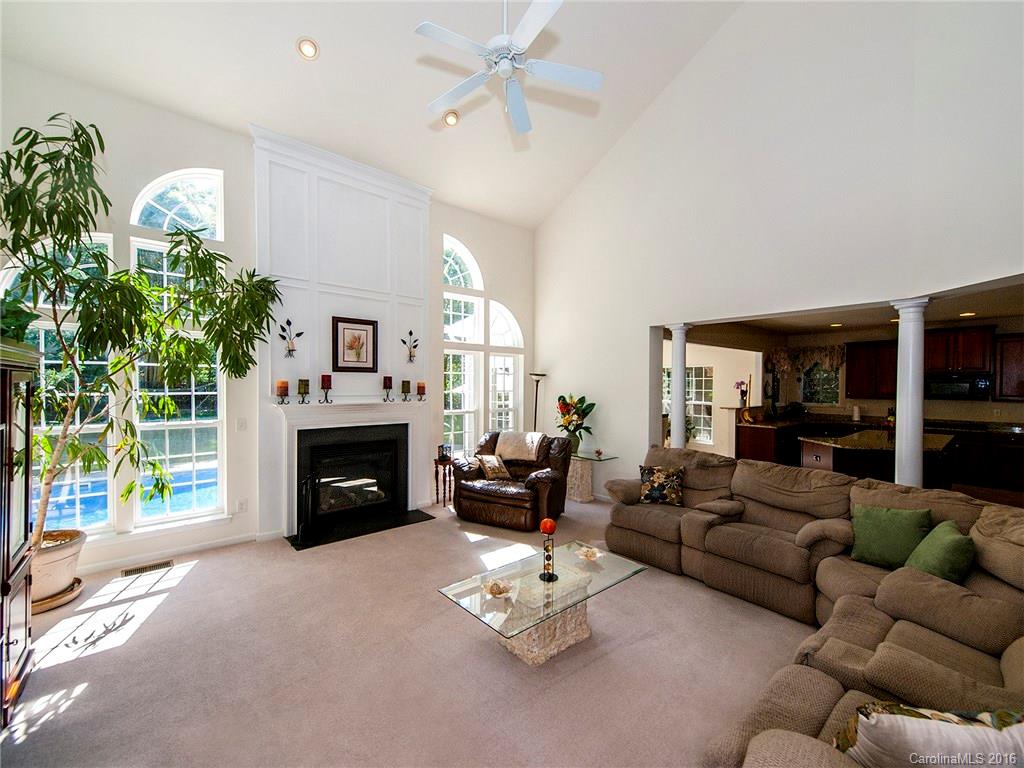 748 Drew Avenue Fort Mill, SC 29708 - Photo 9 of 23 a living room with furniture fireplace and a large window