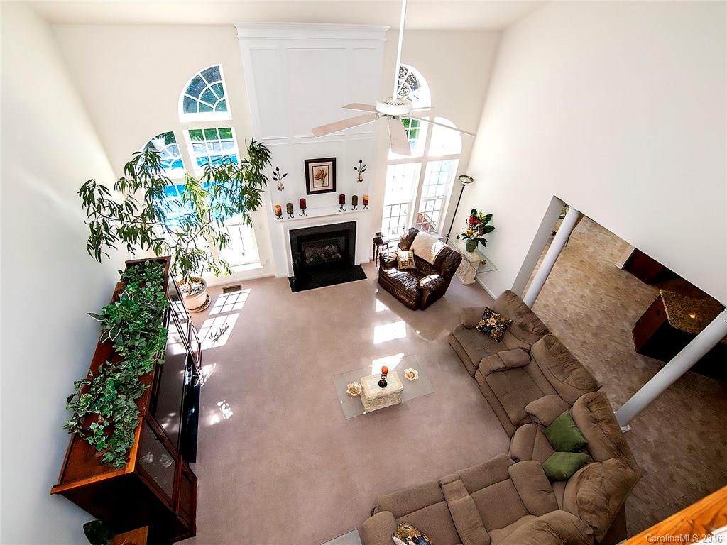 748 Drew Avenue Fort Mill, SC 29708 - Photo 10 of 23 a living room with furniture chandelier and a fireplace