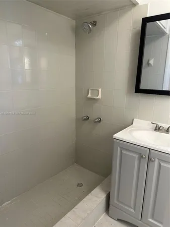 a bathroom with a sink a vanity and a mirror