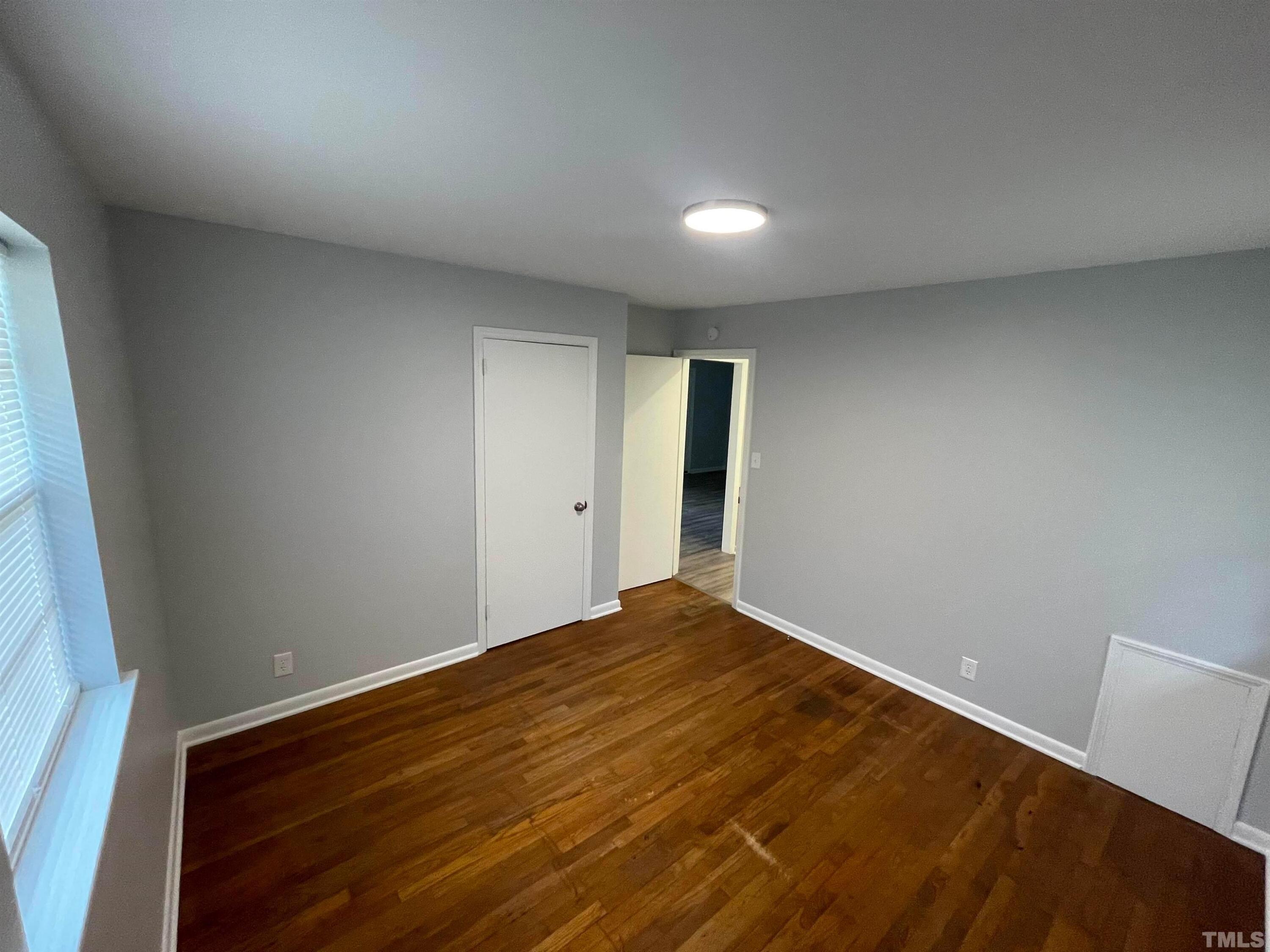 334 Clark Street, Unit A Durham, NC 27701 - Photo 16 of 16 a view of empty room with wooden floor