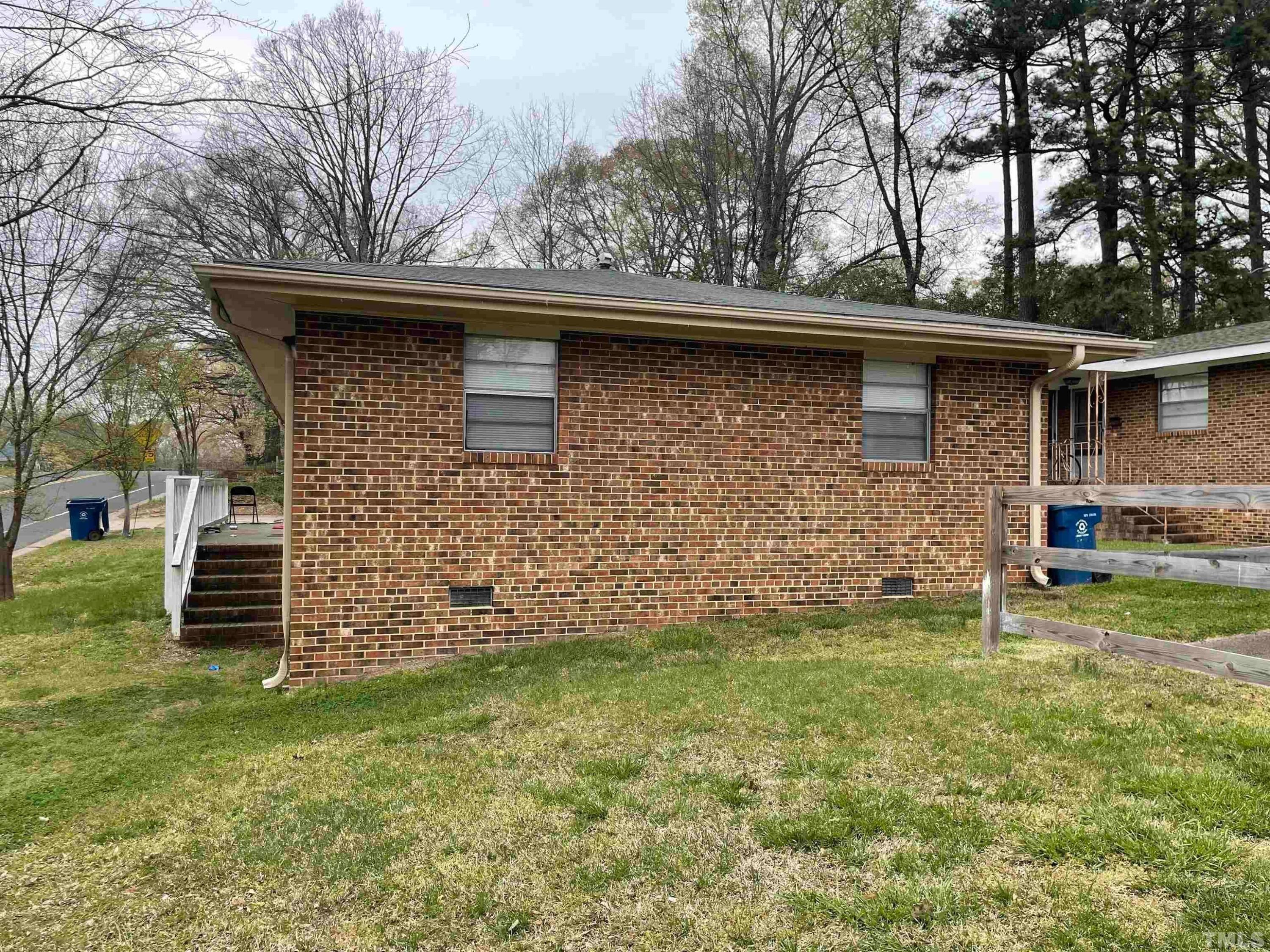 334 Clark Street, Unit A Durham, NC 27701 - Photo 3 of 16 a backyard of a house with lots of green space