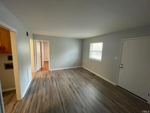 a view of hallway with wooden floor