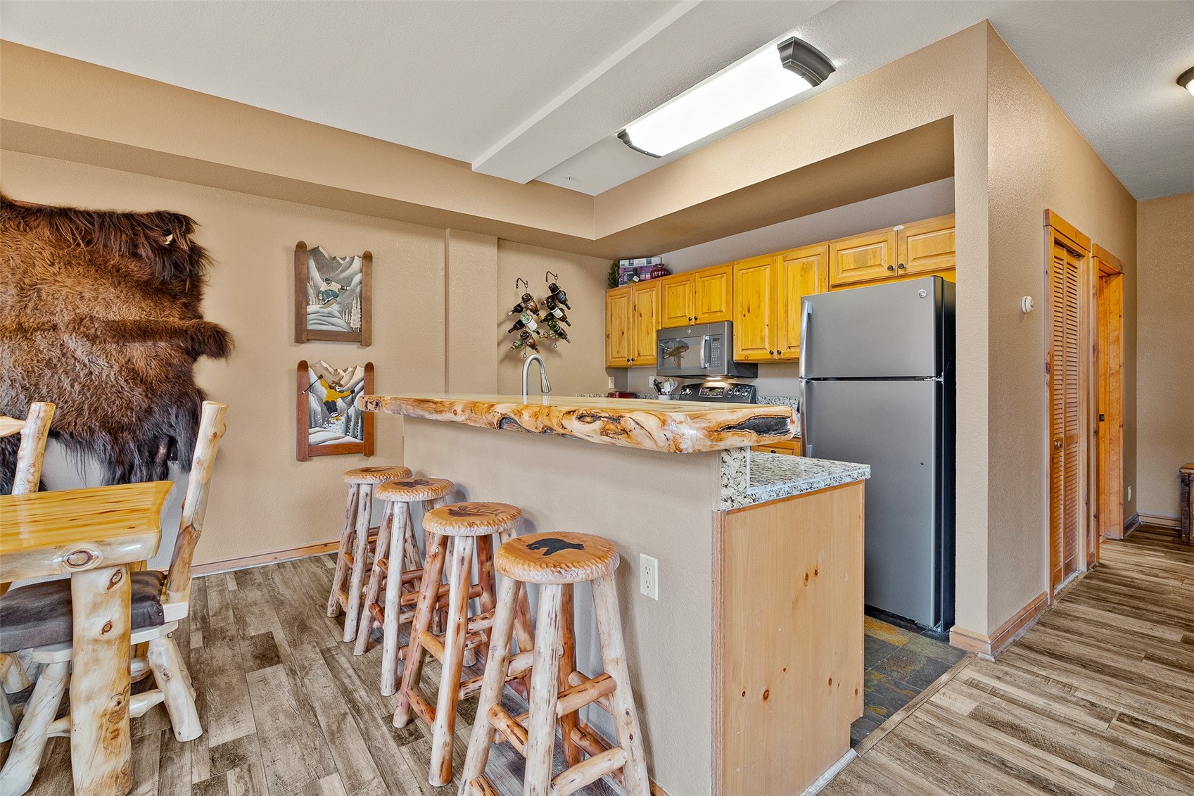 57 Lake Ridge Circle, Unit 1848 Keystone, CO 80435 - Photo 14 of 49 a kitchen with stainless steel appliances granite countertop a refrigerator and a sink