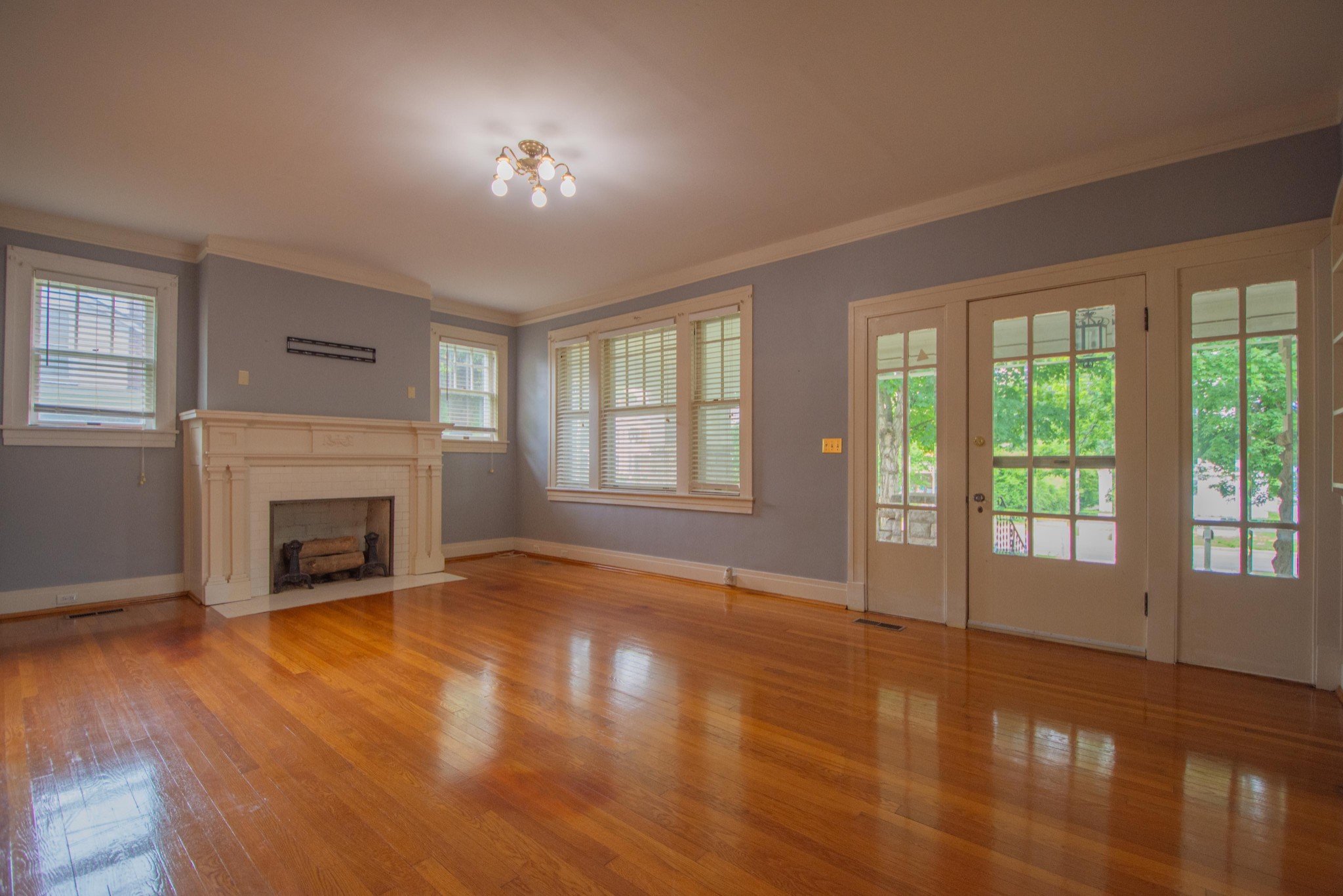 311 South 3rd Street Pulaski, TN 38478 - Photo 13 of 44 a view of empty room with fireplace and wooden floor