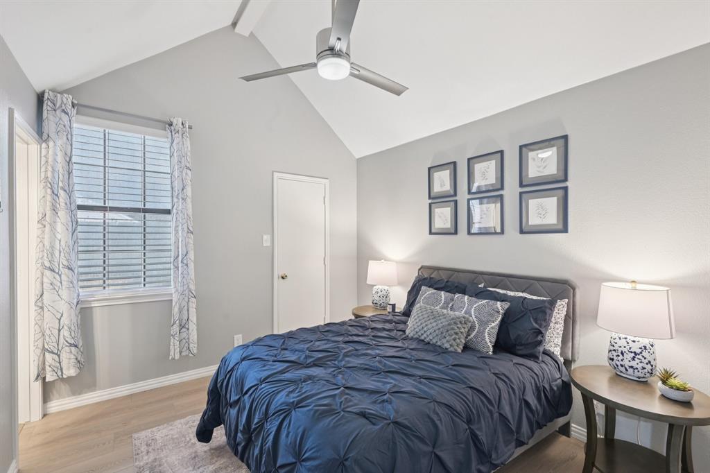 209 Cimarron Trail, Unit 6 Irving, TX 75063 - Photo 13 of 39 a bedroom with a bed and a window
