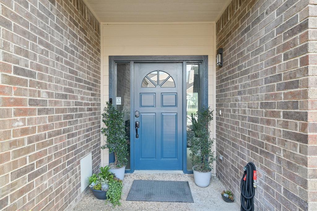 209 Cimarron Trail, Unit 6 Irving, TX 75063 - Photo 16 of 39 a view of a wooden door of the house