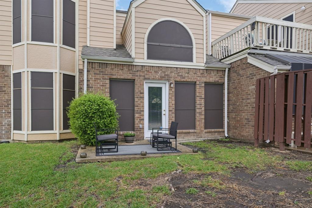 209 Cimarron Trail, Unit 6 Irving, TX 75063 - Photo 38 of 39 a view of a house with backyard and porch