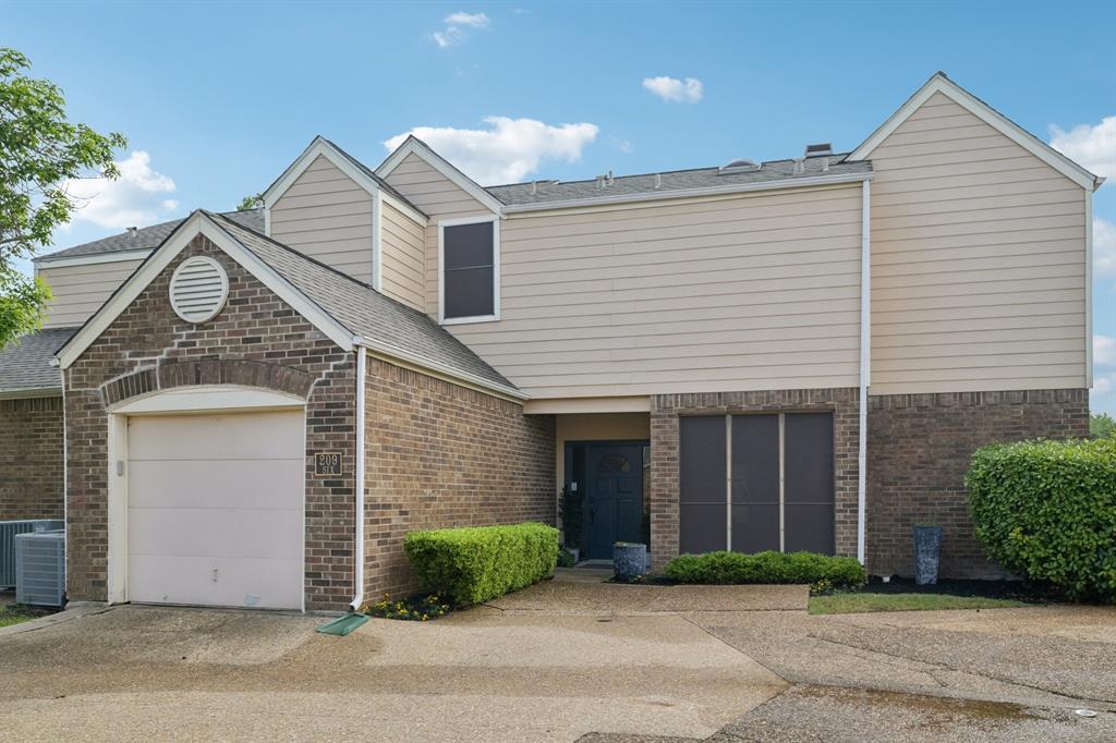 209 Cimarron Trail, Unit 6 Irving, TX 75063 - Photo 39 of 39 a view of a white house