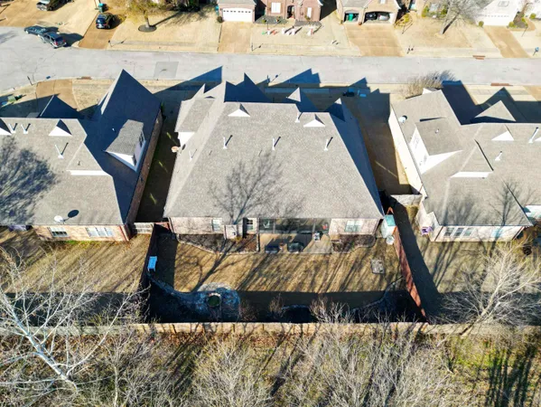 an aerial view of a house with swimming pool