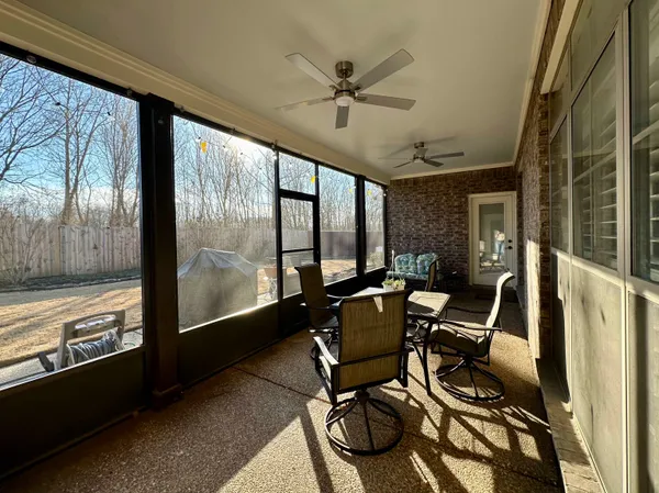 a view of workspace with wooden floor and windows
