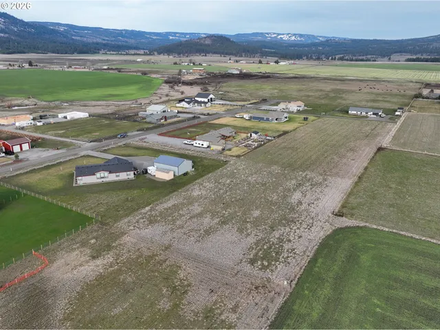 an aerial view of a house with outdoor space