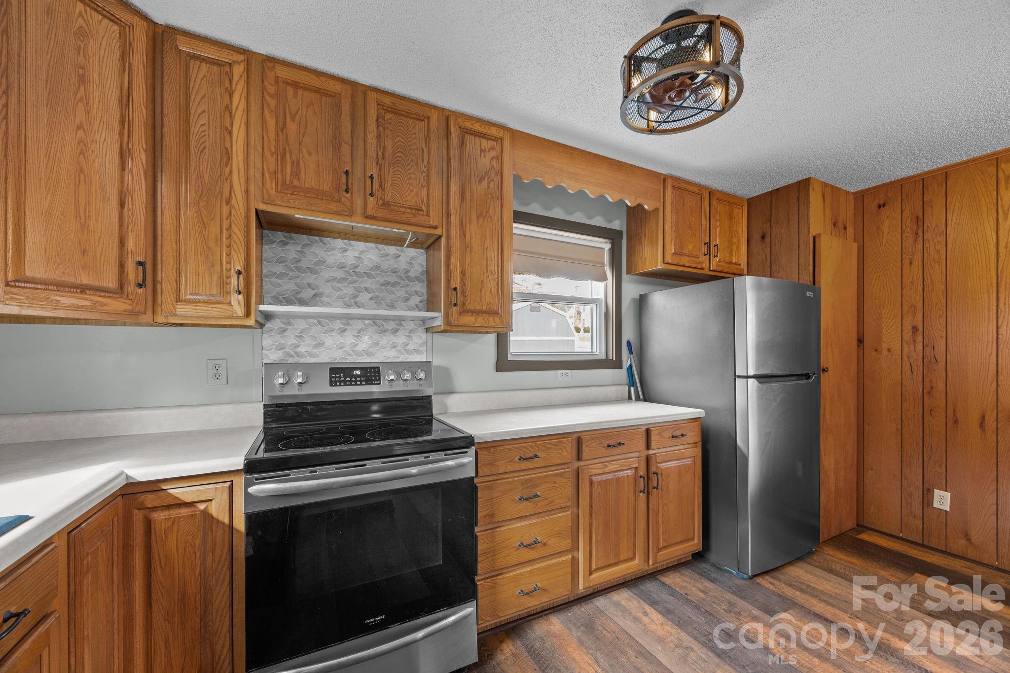 1169 Rickman Creek Road Franklin, NC 28734 - Photo 16 of 43 a kitchen with cabinets appliances and a counter space